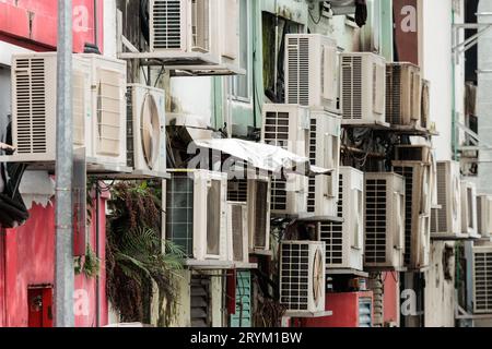 Multiple air-conditioning units stacked in a street of Singapore Stock Photo