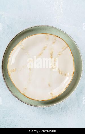 An Empty Plate With A Gold Rim, Top Shot On A Slate Background Stock 