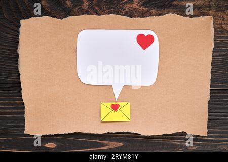 Postcard with email icon, red heart and speech bubble in paper art style. Love letter, greeting card, invitation mockup Stock Photo