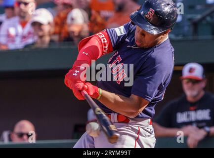 Boston Red Sox second baseman Mark Bellhorn walks in the rain past