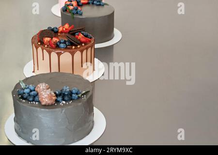 Festively decorated cakes on table. Confectionery for holiday. Selective focus Stock Photo