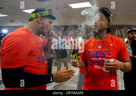 Houston Astros' Justin Verlander, left, and Hector Neris, right, celebrate  in the locker room after clinching the AL West title after a baseball game  against the Arizona Diamondbacks, Sunday, Oct. 1, 2023