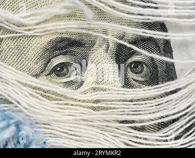 Fragment of one hundred dollar bill with a portrait of Benjamin Franklin, eye Stock Photo