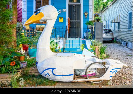 NEW ORLEANS, LA, USA - SEPTEMBER 28, 2023: Wheeled papier mache bird figure parked in front of an historic uptown cottage Stock Photo