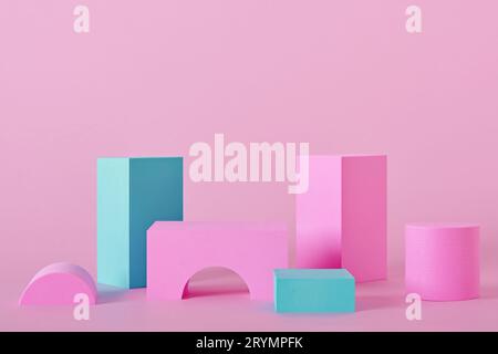 Abstract pink background with different shape podiums for products presentation or exhibitions. Geometric composition with copy Stock Photo