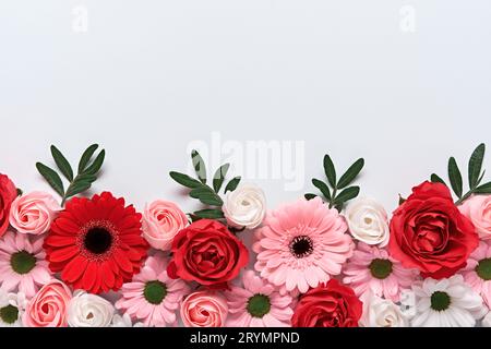 Floral composition of roses and gerberas on grey background. Arrangement of beautiful flowers Stock Photo