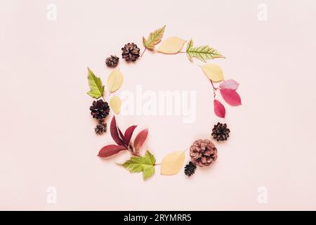 Autumn frame wreath of colorful leaves and cones. Autumn greeting background Stock Photo