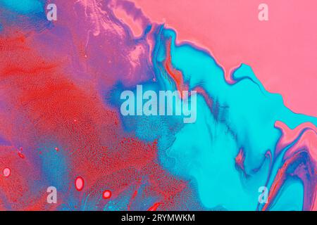 Acrylic Fluid Art. Glowing pink red waves and blue curls. Abstract neon background or texture Stock Photo