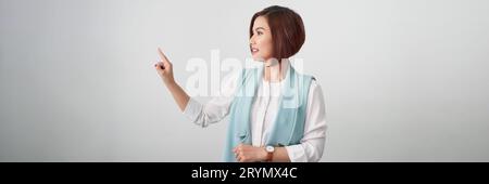 Businesswoman pressing button or something with copy space for your design. Panorama Stock Photo