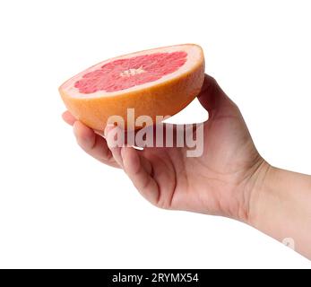 A woman's hand holds half a grapefruit on a white isolated background Stock Photo