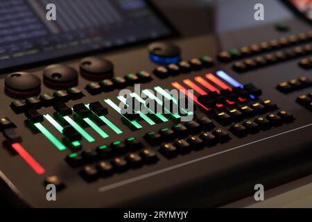 Wheels, keys and faders on the lighting control console. Selective focus. Stock Photo