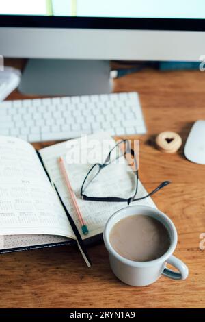 Workplace calendar computer coffee Stock Photo