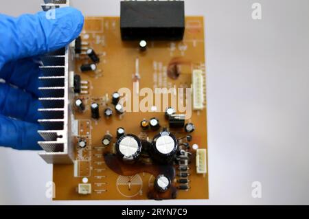 Cairo, Egypt, September 19 2023:  Electronic board of a car subwoofer amplifier sound control panel unit, A subwoofer (or sub) is a loudspeaker design Stock Photo