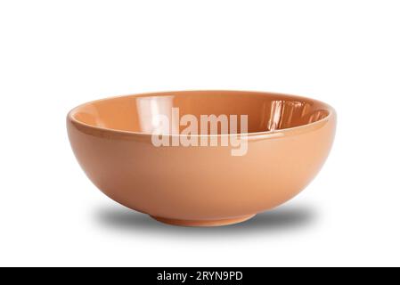 Closeup view of new empty brown ceramic bowl isolated on white background. Stock Photo