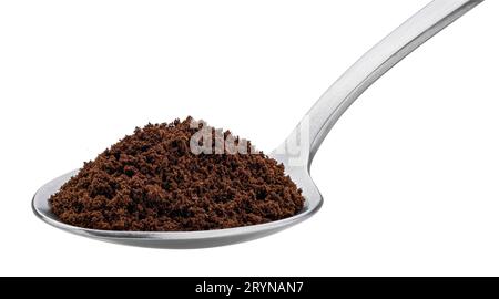 Ground coffee beans in spoon isolated on white background Stock Photo