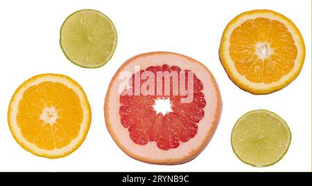 Sliced pieces of orange, lime and grapefruit on a white background, top view Stock Photo