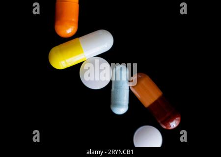 Colorful pills, suplements and vitamins, drugs background Stock Photo