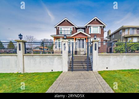 Big family house on blue sky background Stock Photo - Alamy