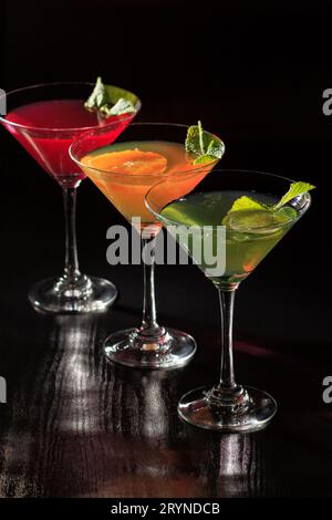 Kiwi, orange and cherry jelly with lime pieces in the glasses Stock Photo