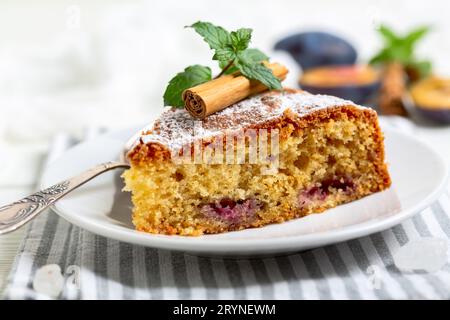 Piece of pie with blue plums. Stock Photo