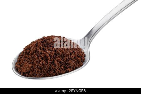 Ground coffee beans in spoon isolated on white background Stock Photo