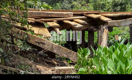 Transpantaneira - typical run-down wooden bridge crossing a river in the Pantanal Wetlands, Mato Gro Stock Photo