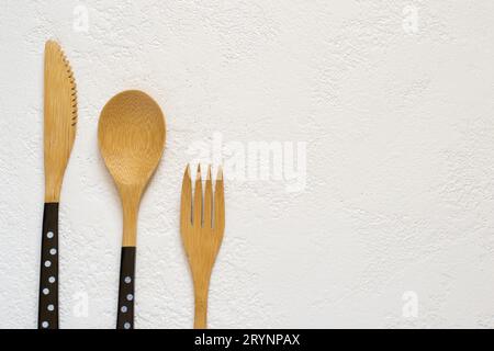 Bamboo fork, knife and spoon on white background closeup, Top vi Stock Photo