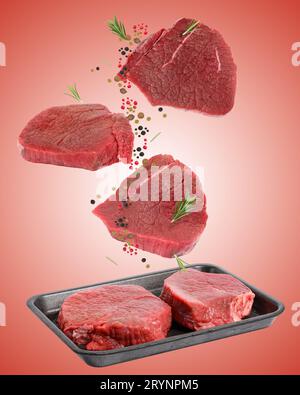 Pieces of beef steak in a black disposable polystyrene plate on a white isolated background Stock Photo