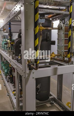 Machinery in a machine room at a factory Stock Photo