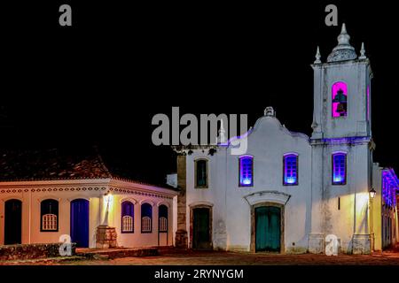 Atmospheric night view of illuminated church Nossa Senhora das Dores (Our Lady of Sorrows)  in historical center of Paraty, Braz Stock Photo