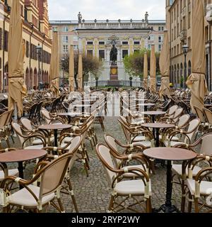 Empty chairs, Naschmarkt in the early morning in front of the Old Stock Exchange, Leipzig, Germany Stock Photo