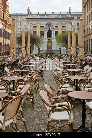 Empty chairs, Naschmarkt in the early morning in front of the Old Stock Exchange, Leipzig, Germany Stock Photo