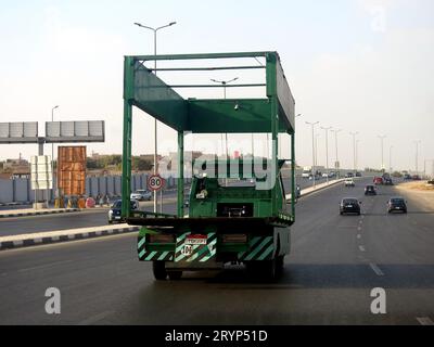 Cairo, Egypt, September 19 2023: Electric vehicle mounted lifting hoist on flatbed truck for emergency transportations of cars that needs maintenance, Stock Photo
