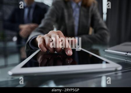 close up. businessman pressing his finger on the screen of the digital tablet Stock Photo