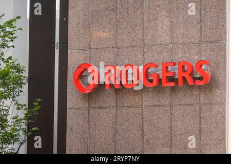 Calgary, Alberta, Canada. Jun 4, 2023. A Rogers entrance sign. A Canadian communications and media company operating in the fiel Stock Photo