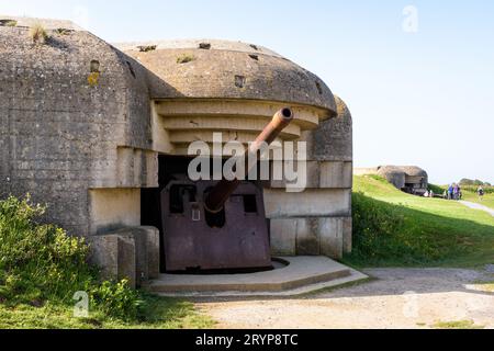 Two bunkers holding a 150 mm gun in the Longues-sur-Mer battery in Normandy, a WWII German coastal artillery battery part of the Atlantic Wall. Stock Photo