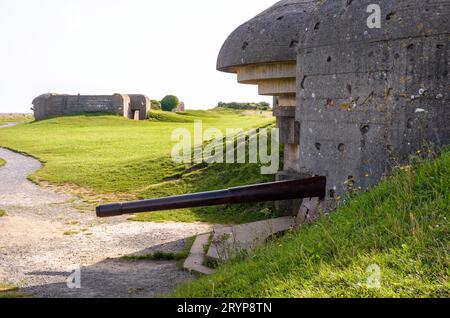 Two bunkers holding a 150 mm gun in the Longues-sur-Mer battery in Normandy, a WWII German coastal artillery battery part of the Atlantic Wall. Stock Photo