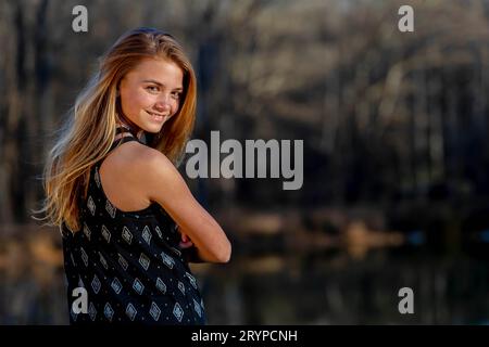 Young Blonde Teenager Enjoys A Beautiful Day Stock Photo