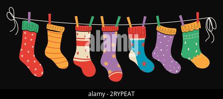Set of colorful bright children socks with textures and patterns on a rope with colored clothespins. Vector illustration. Stock Vector