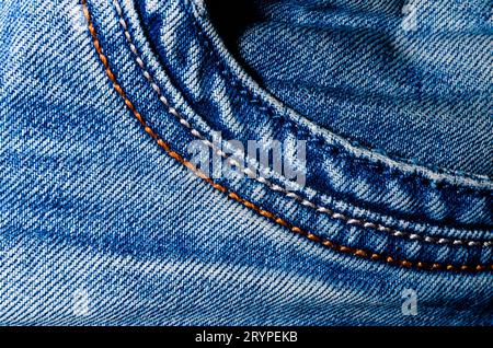 Texture pocket of blue crumpled jeans macro closeup Stock Photo