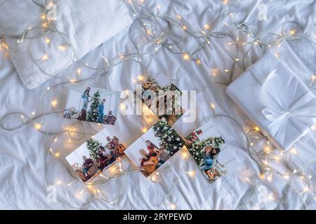 Photos of children against Christmas lights background Stock Photo