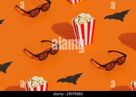 Pattern with striped box with popcorn, bat napkin and 3d glasses on an orange background. Halloween celebration concept. Stock Photo