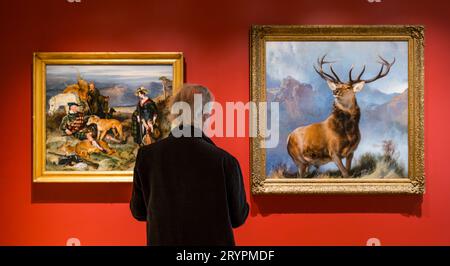 Man looking at Monarch of the Glen stag painting by Sir Edwin Landseer, National Galleries of Scotland newly opened extension, Edinburgh, UK Stock Photo