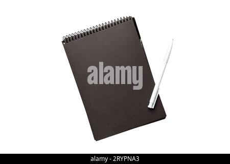 Top view of closed spiral blank dark paper cover notebook with pencil isolated on white background. Stock Photo