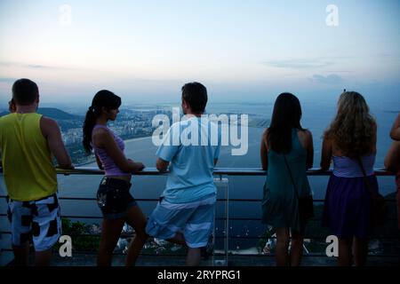 People on top of the Pao Asucar or Sugar loaf mountain with a view over the city, Rio de Janeiro, Brazil. Stock Photo