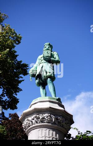 Square du Petit Sablon in Brussels, Belgium. The gardens have 48 bronze statues representing different trade and craft guilds. This is the Clockmaker. Stock Photo