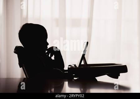 Baby boy  using digital tablet Stock Photo
