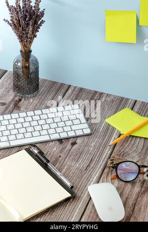 office supplies and coffee cup on wood table. View from above Stock Photo