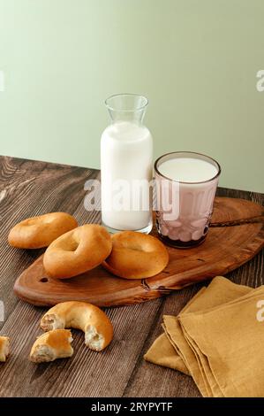 Milk and bagels on a wooden table Stock Photo