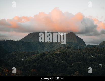 A view of the mountains from Petit and Gros Piton on St. Lucia in the Caribbean under blue skies. Photo taken near Soufriere. Stock Photo